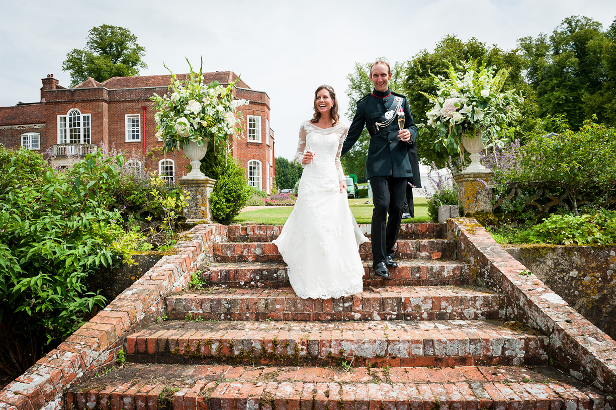 bride & groom enter reception summer garden Ovington Hampshire